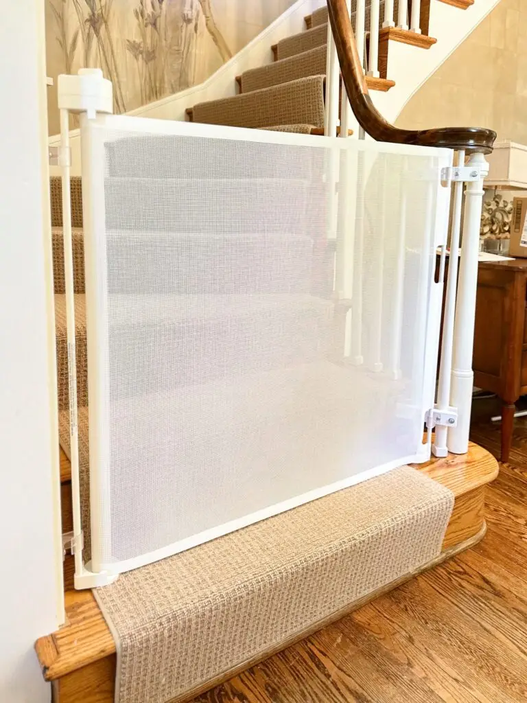 Retractable gate at bottom of staircase