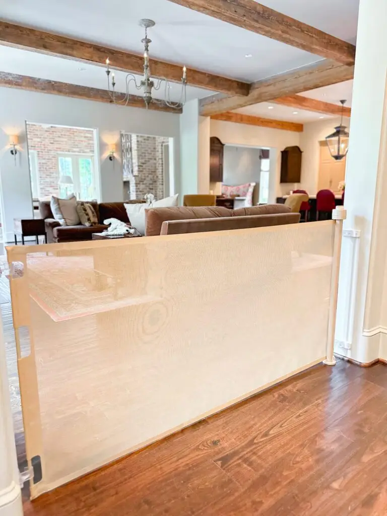 Indoor retractable gate separating living spaces