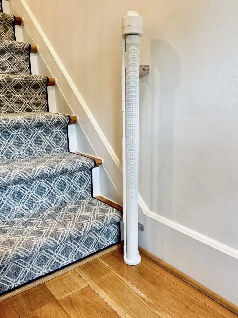 Staircase with white safety retractable gate