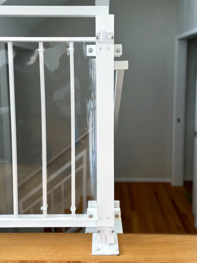 Modern white railing with kid shield and post clamp