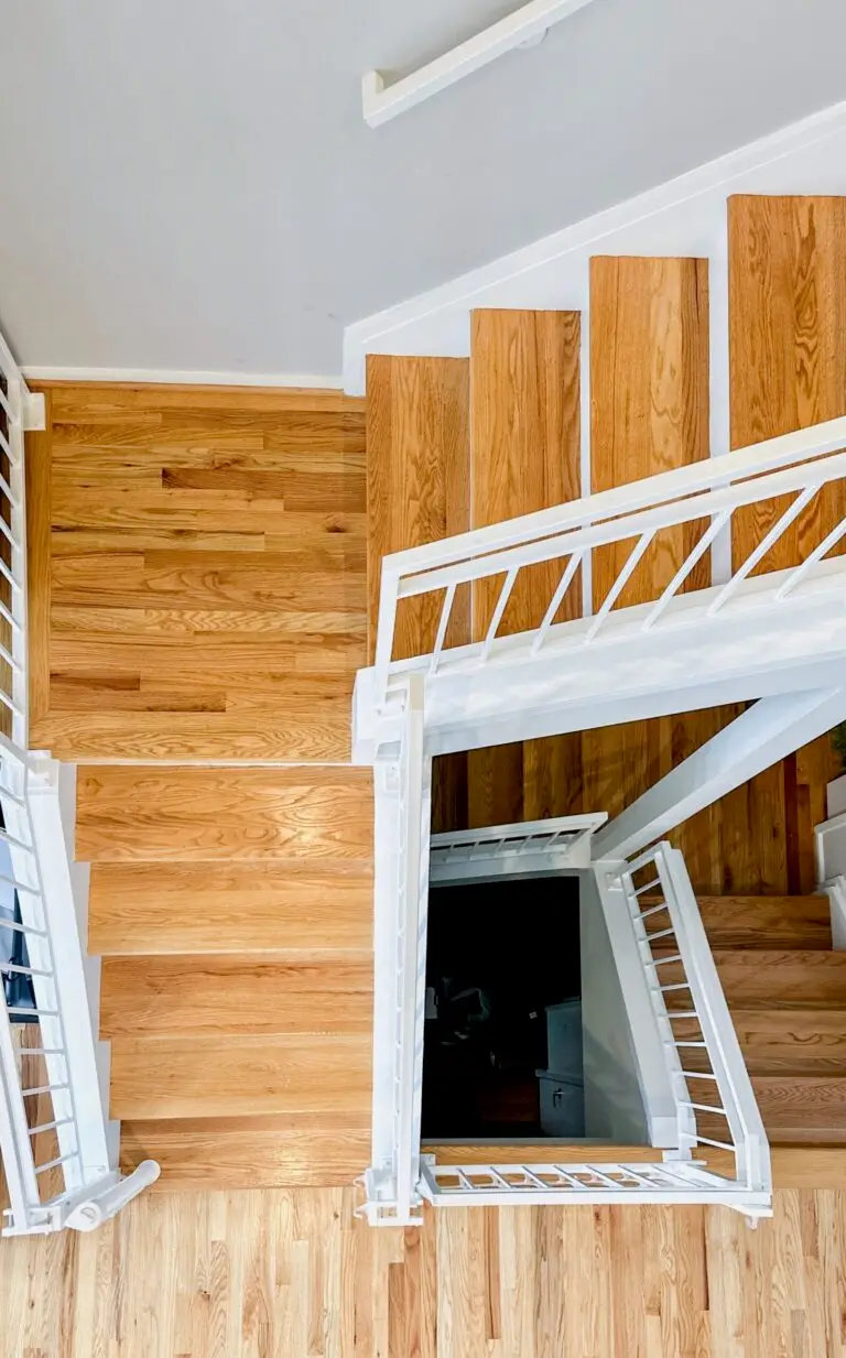 Wooden staircase with white railings