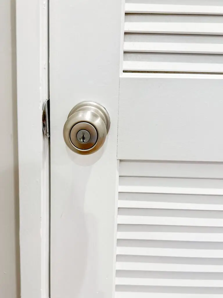 White door with round locked silver knob