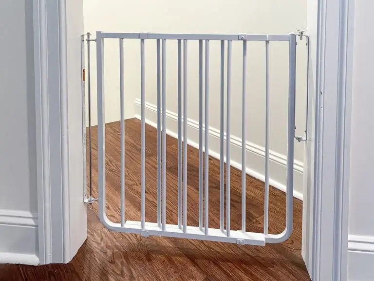 White stairway gate installed in doorframe