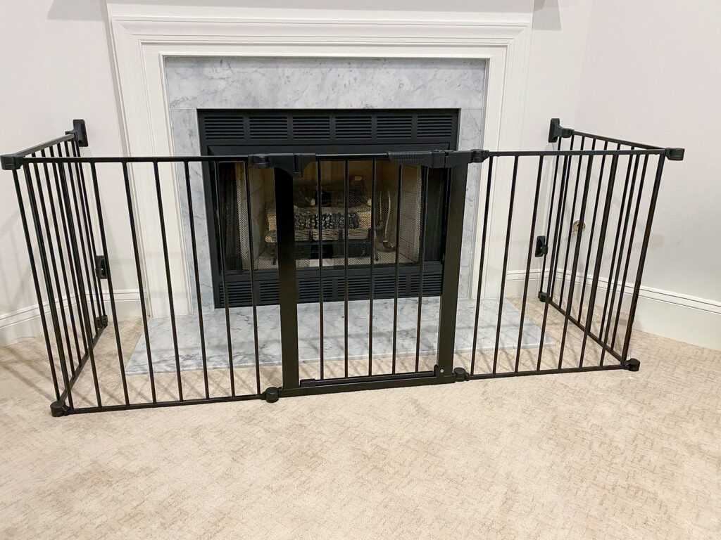 Hating on Hearth Gates (and 5 Better Alternatives) 1 Hearth gate installed on a fireplace.