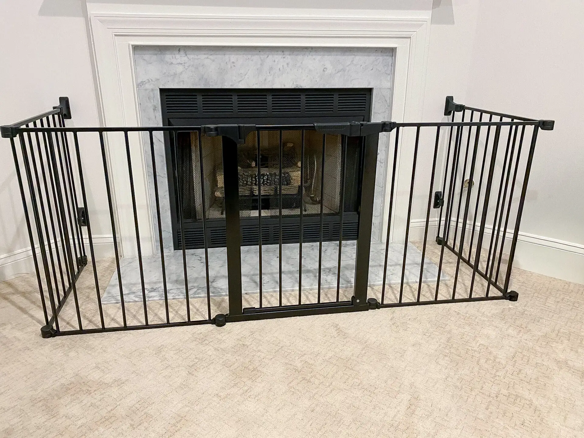 Fireplace baby proofing: hearth gate installed on a fireplace.
