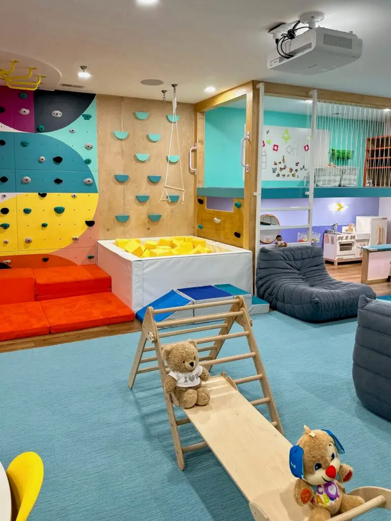 Colorful playroom with climbing wall
