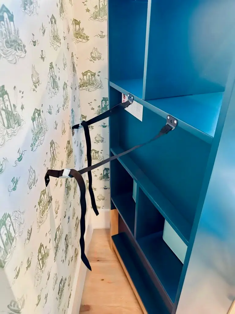 Blue shelf secured to wall