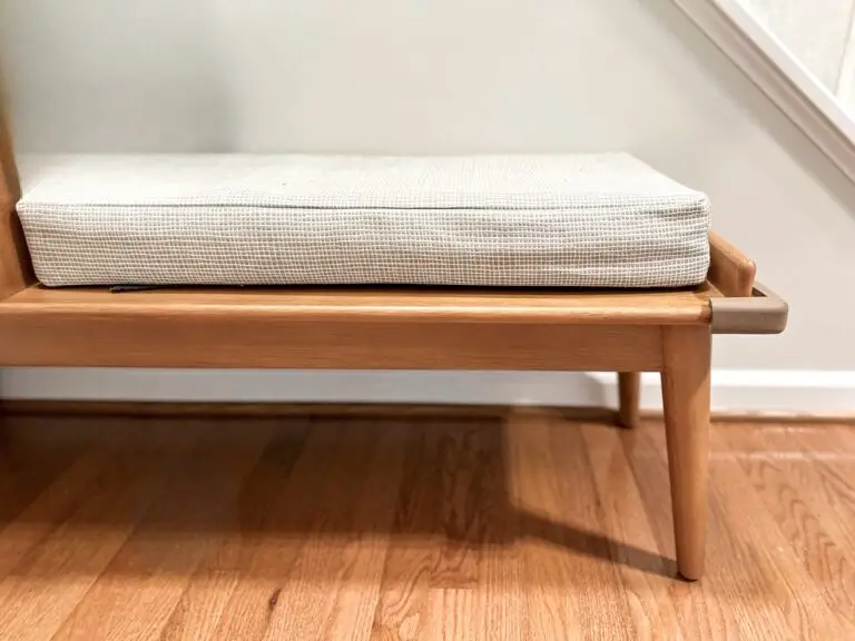 Brown corner cushion on bench