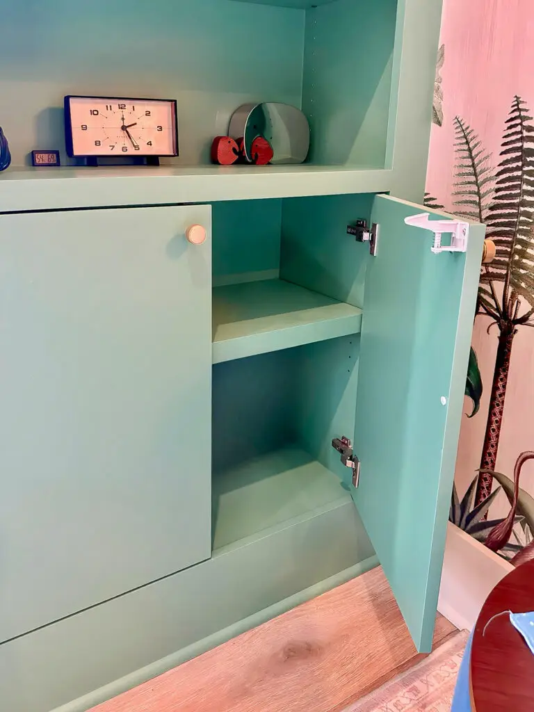 Open teal cabinet with cabinet lock