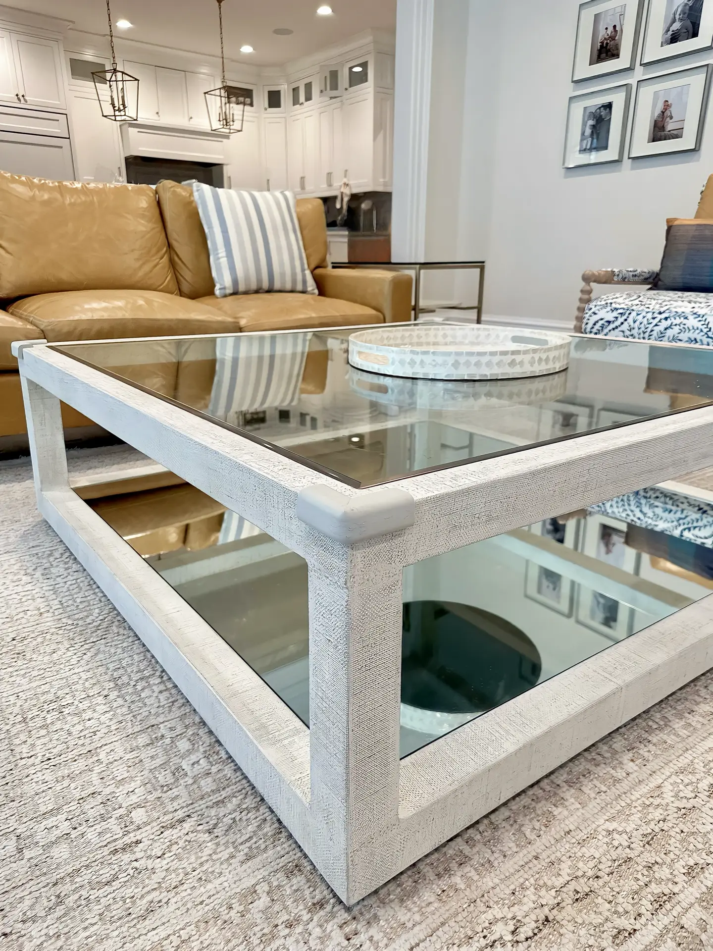Modern baby proofing in a living room with glass coffee table and corner cushion