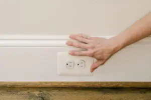 Checking the tamper resistance of an outlet in a home.