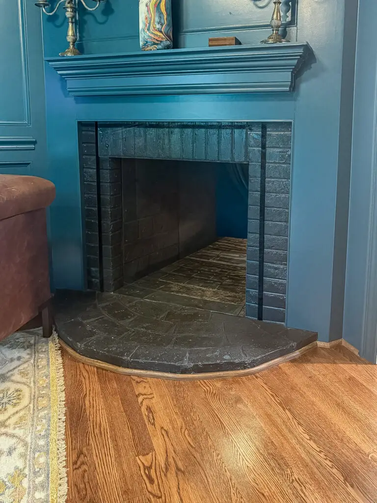 Study fireplace with a brick firebox covered with clear plexiglass in a bethesda, md home