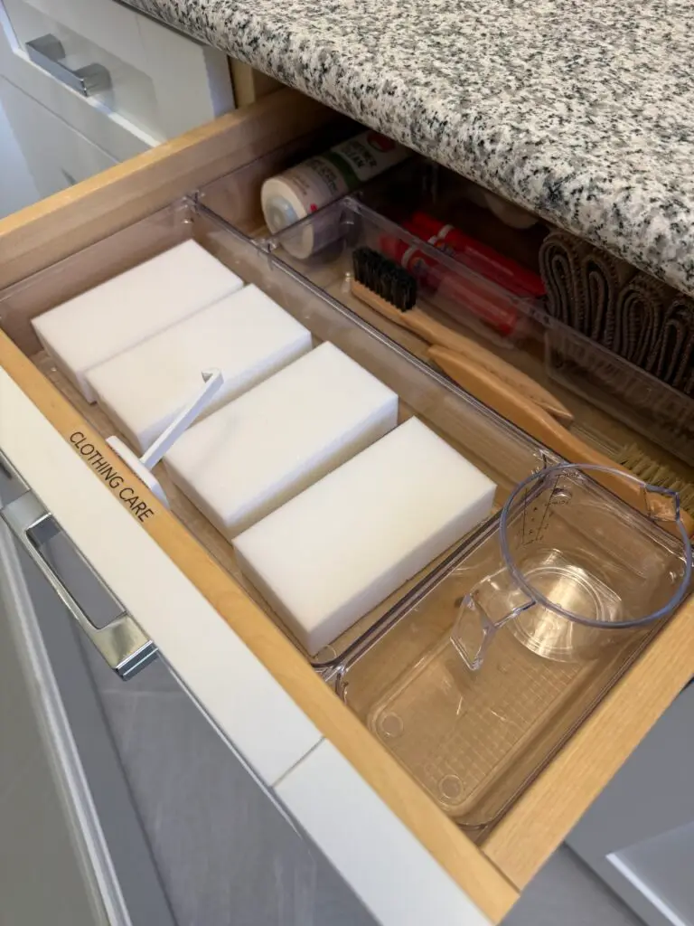 Child-safety drawer latch on a drawer, shown open