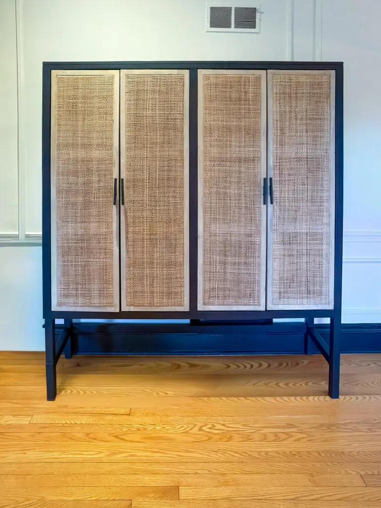 Cane-front cabinet secured to the wall in a palisades, dc home