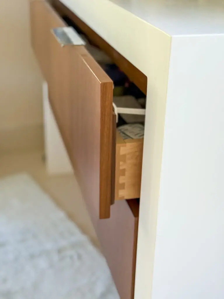 Drawer latch installed on a bathroom vanity drawer