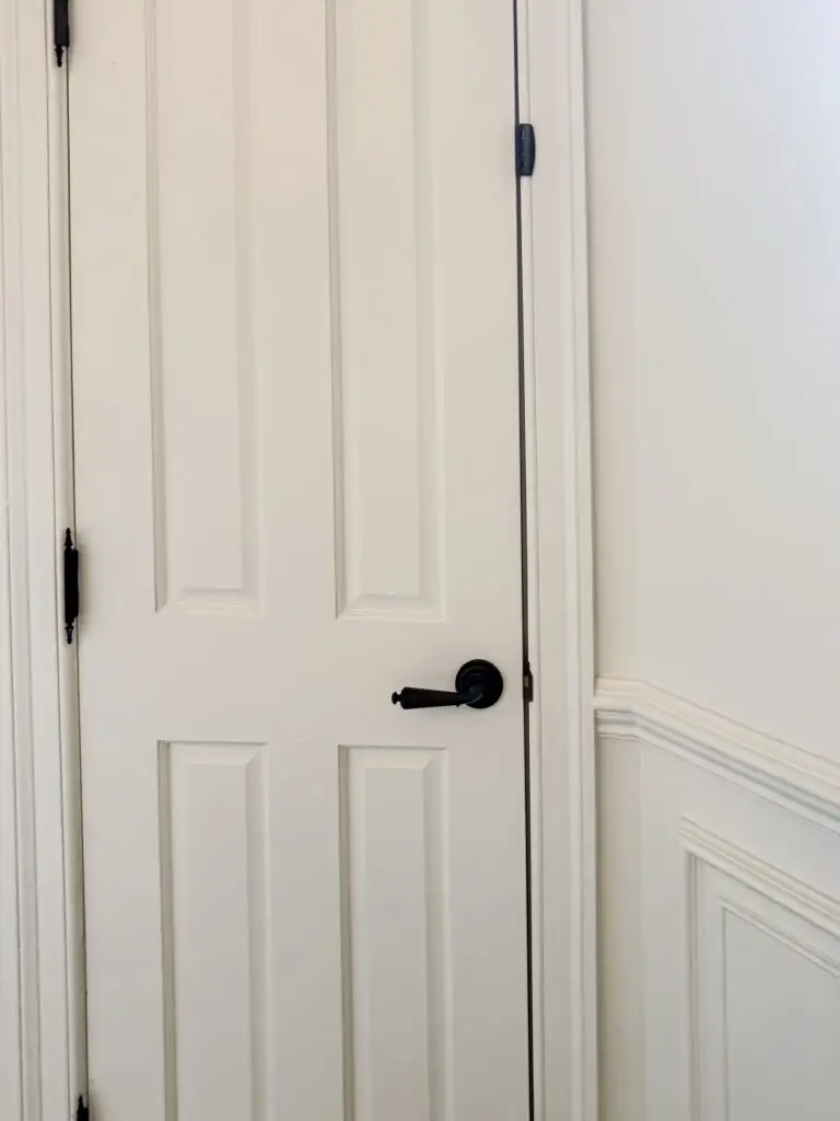 Top door lock installed at the top of a bathroom door