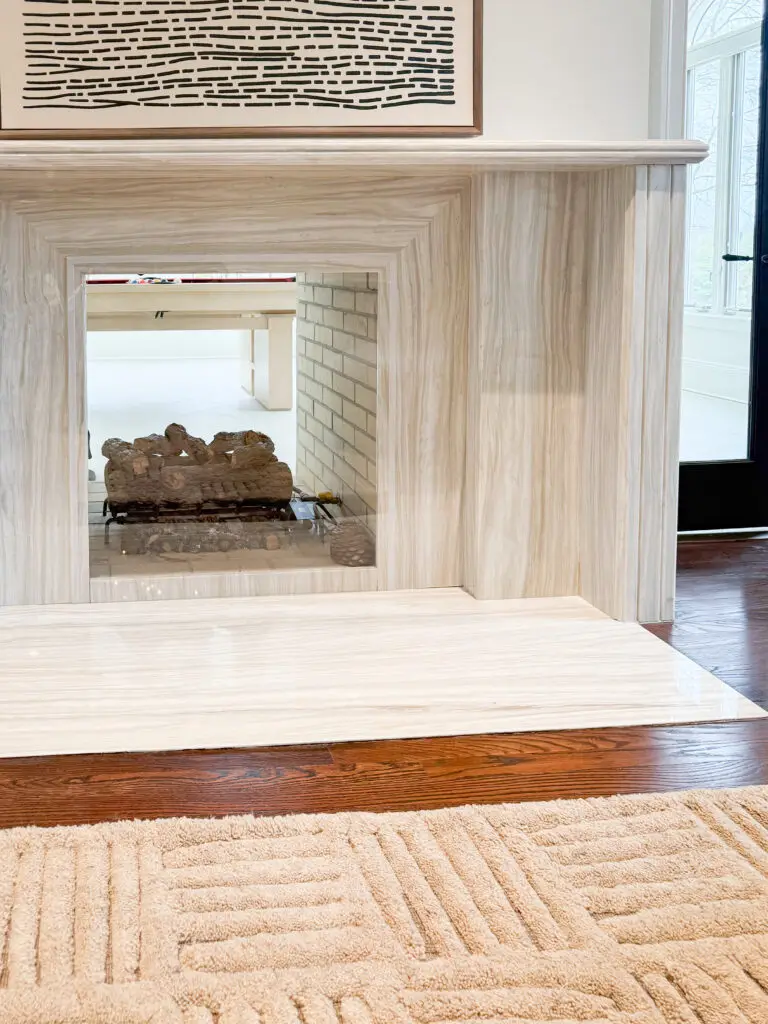 Close-up of the see-through fireplace opening with clear plexiglass across the firebox
