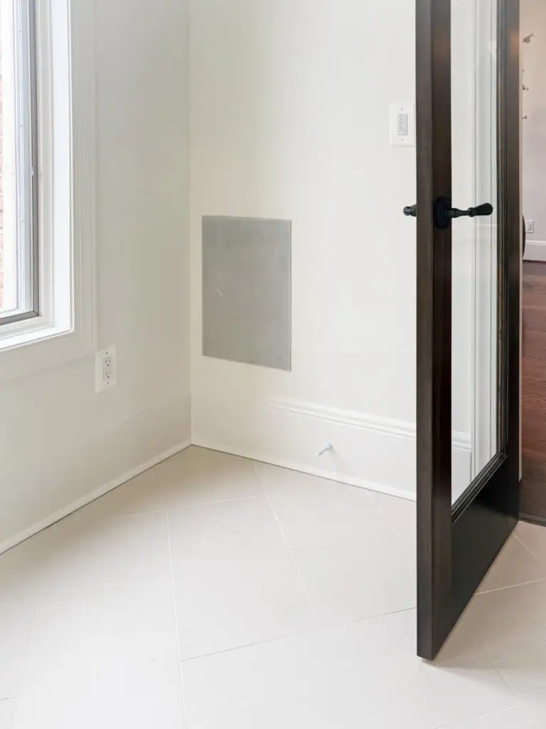 Bathroom doorway with a black-framed glass door in a maryland home