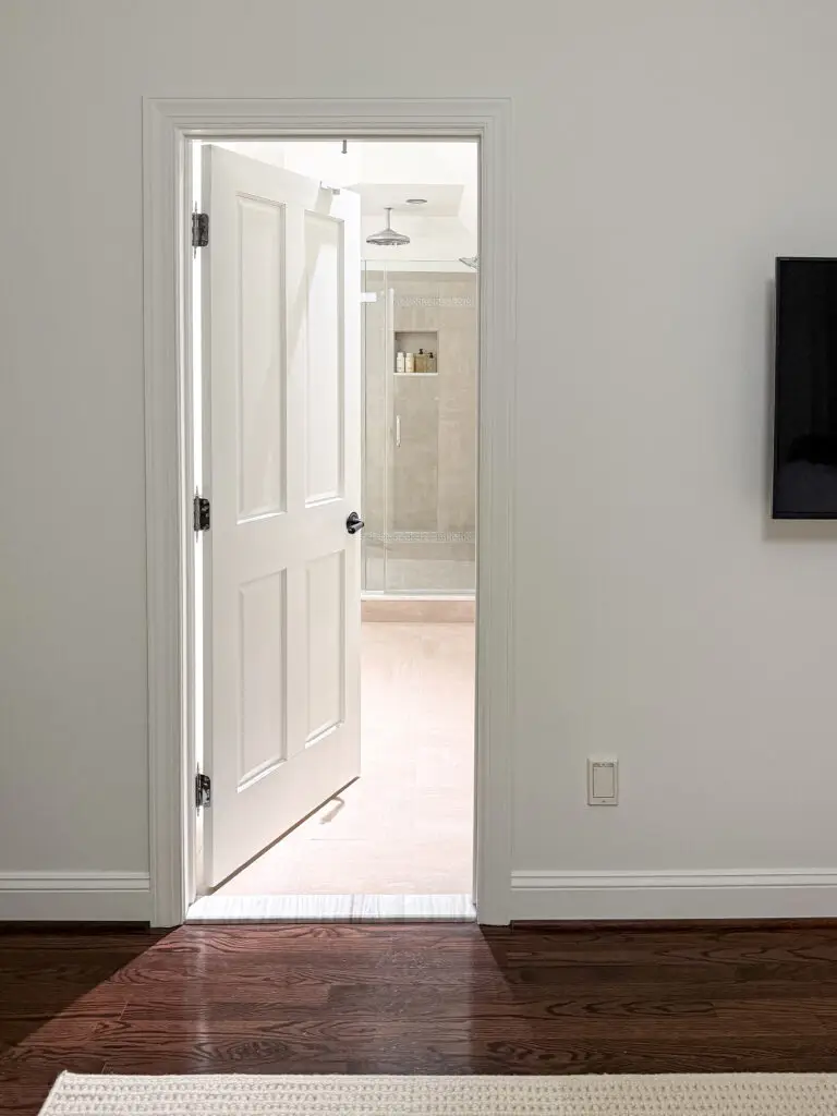 Doorway to the bathroom, fitted with a top door lock, seen from the bedroom