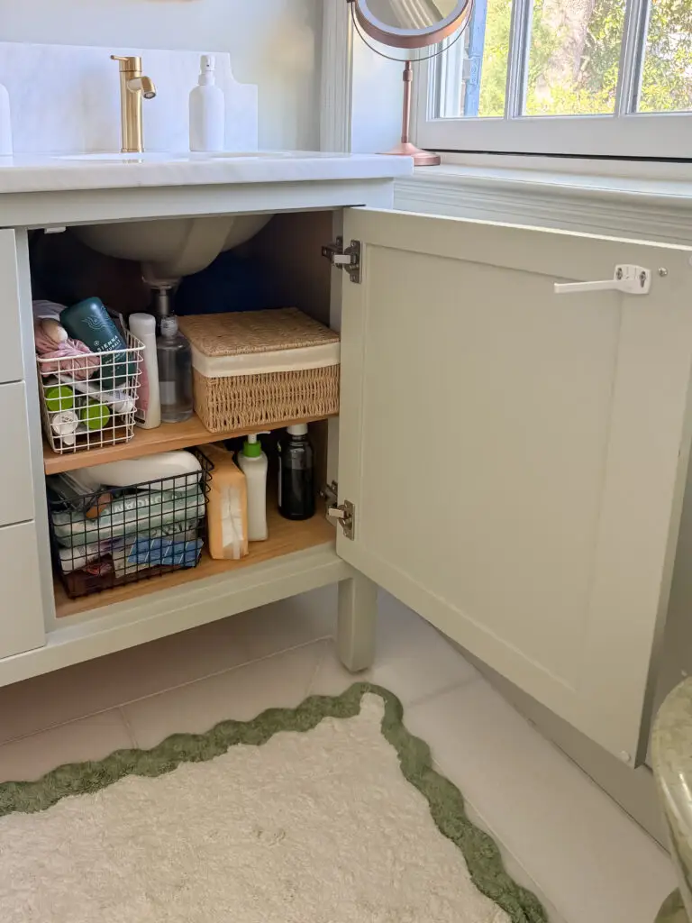 Under-sink vanity cabinet with a child-safety latch in a forest hills, dc bathroom