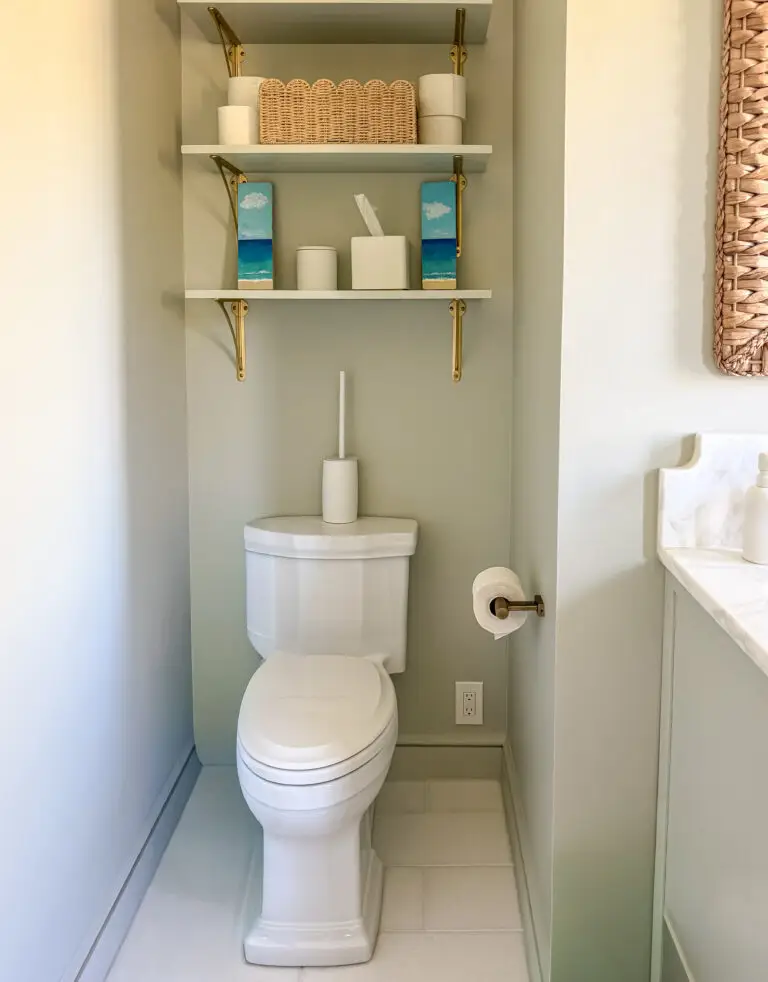 Bathroom in a forest hills, dc rowhouse with shelving mounted above the toilet