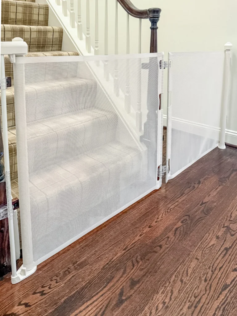 White retractable gates closed across the stairs to the third floor